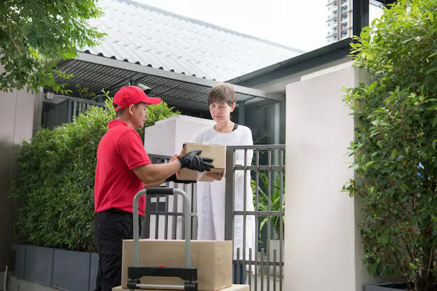 asian-delivery-man-red-uniform-delivering-parcel-boxes-woman-recipient-home_126277-829 Asian delivery man red uniform delivering parcel boxes woman recipient home 126277 829